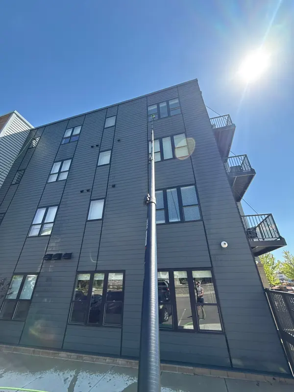 Water-fed pole reaching the top floors of an apartment building