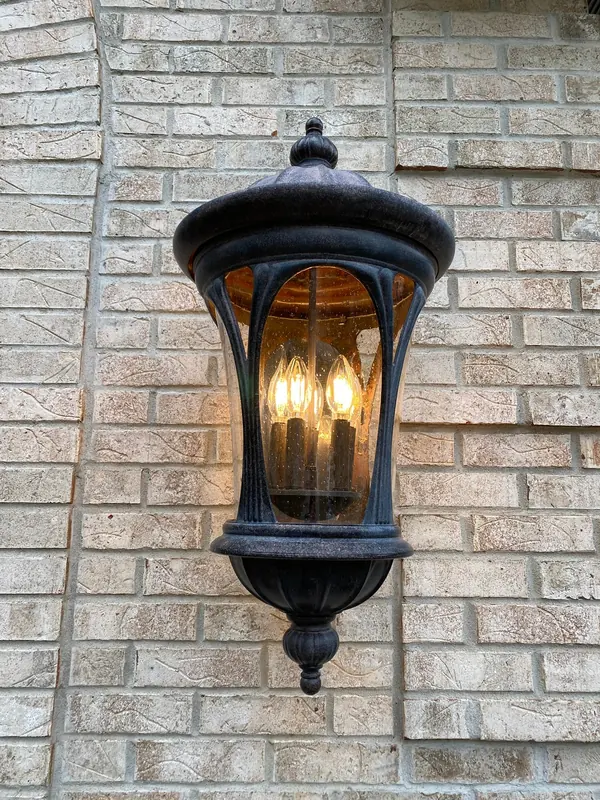 Cleaned outdoor lantern on a brick wall