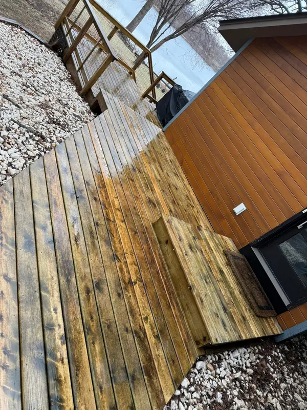 Cleaned wood deck beside a house