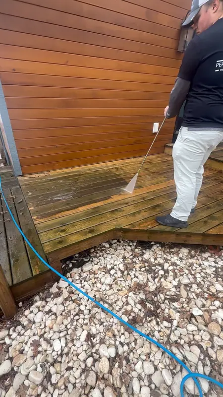 Pressure washing a wood deck