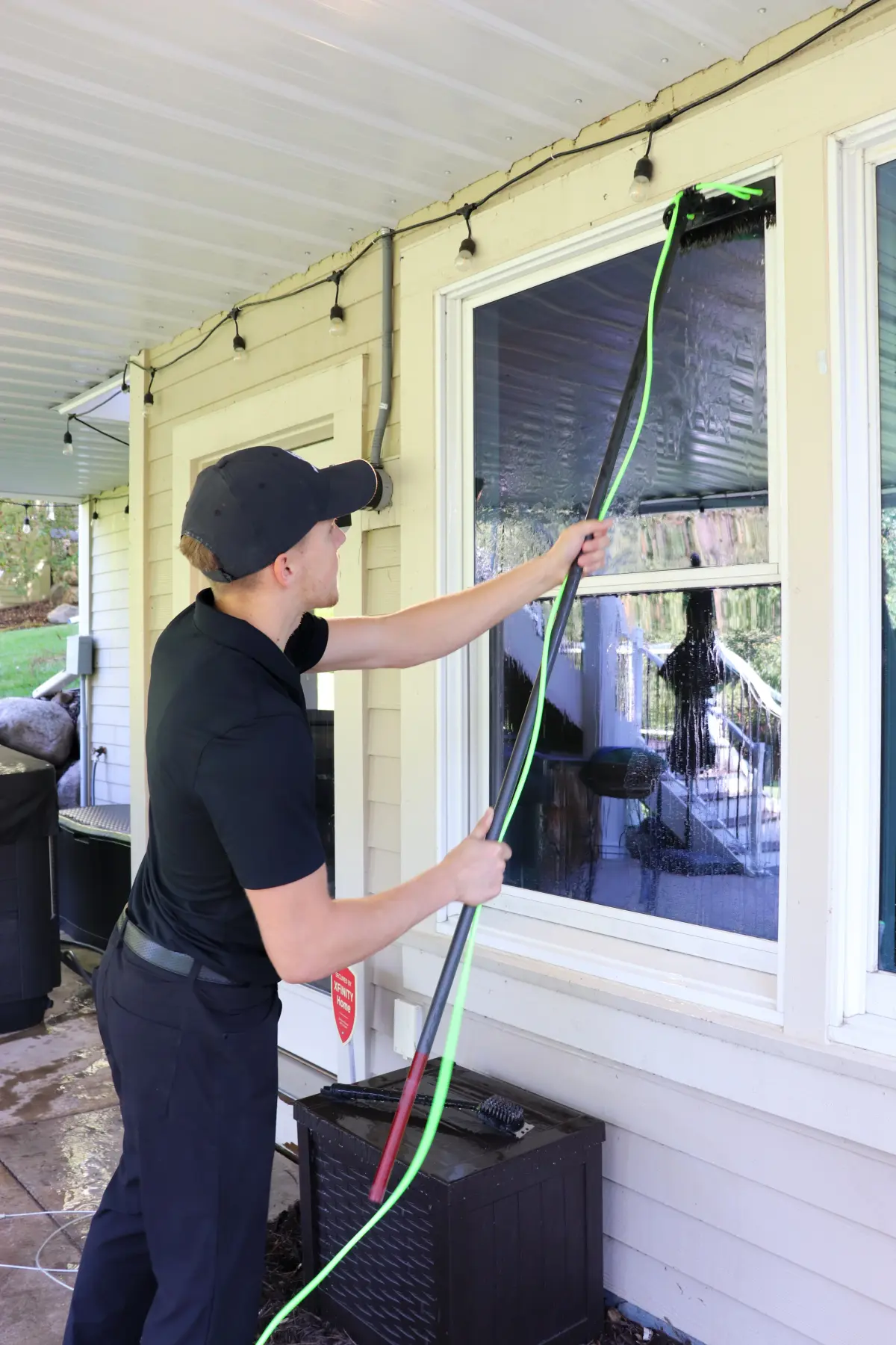 A Peregrine window cleaner at work on a Twin Cities home