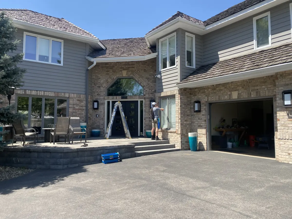 A Peregrine window cleaner at work on a Twin Cities home